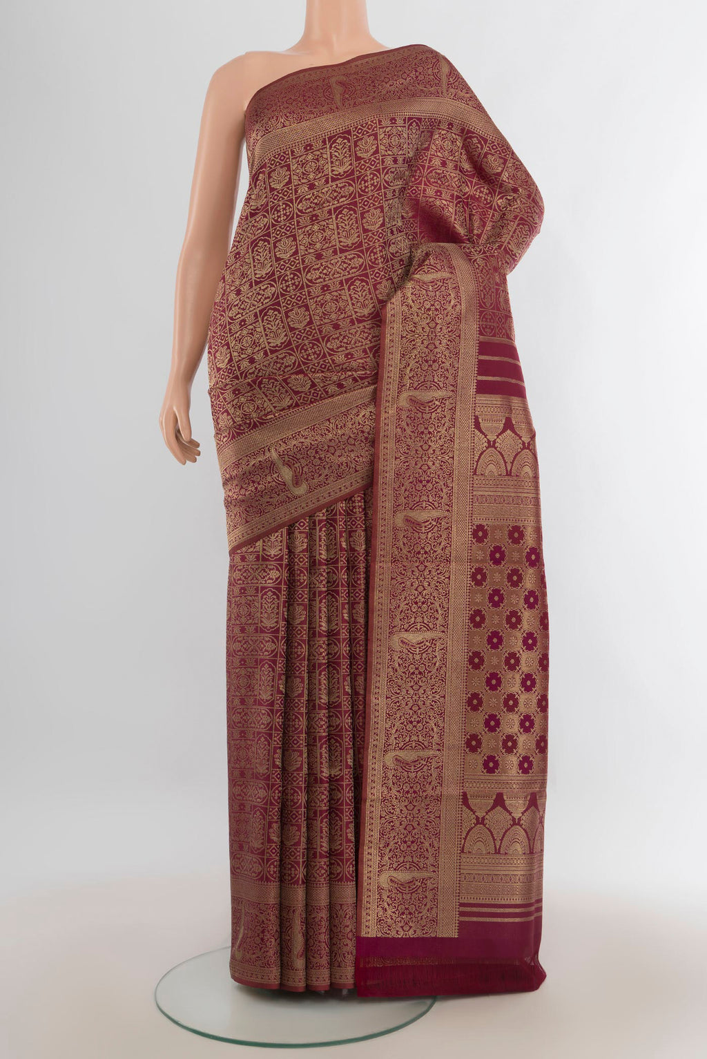 Pure Silk Coffee Brown Kanjivaram Saree with Zari Butta on the body and Silk Border.  displayed on a mannequin