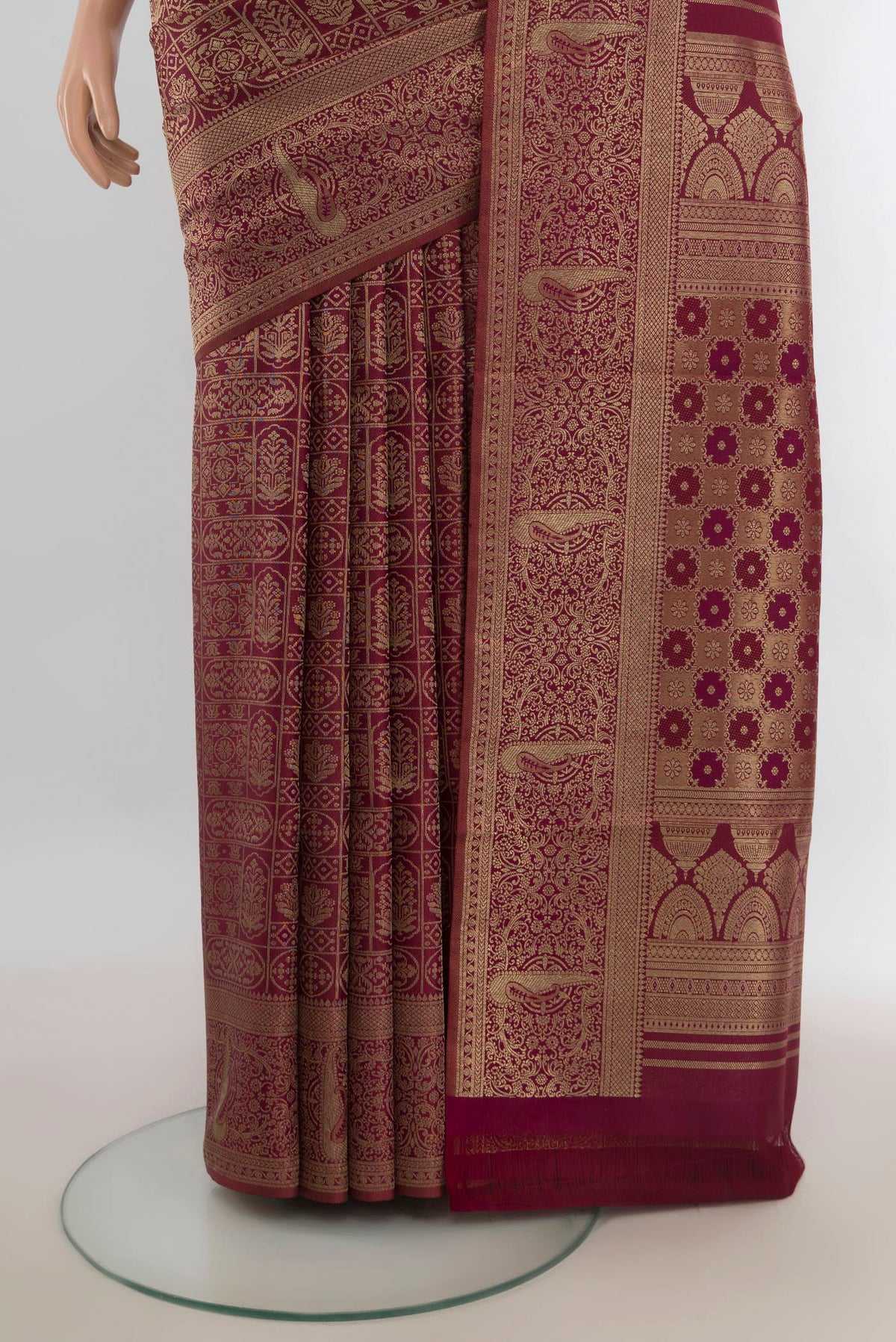 Pleats and pallu of Pure Silk Coffee Brown Kanjivaram Saree with Zari Butta on the body and Silk Border. 