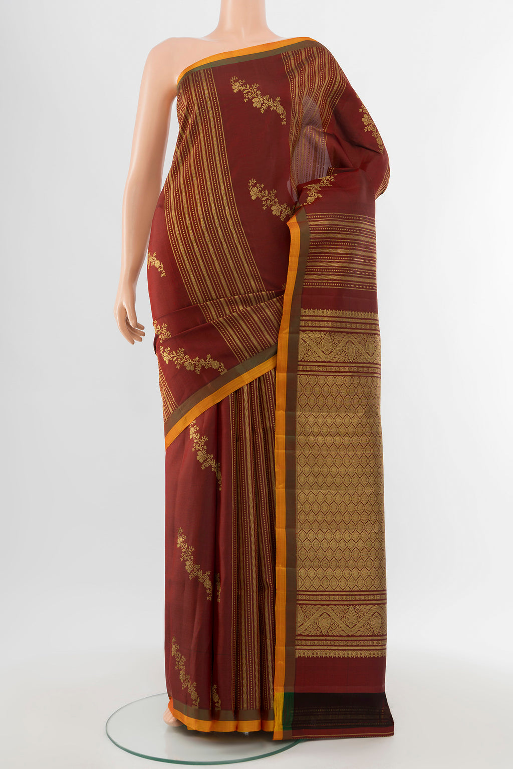 Pure Silk Pure Zari Maroon Kanjivaram Saree with Zari Butta on the body and Silk Border.  displayed on a mannequin