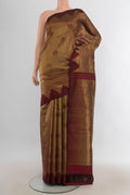 Pure Silk Coffee Brown Kanjivaram Saree with Zari Butta on the body and Silk Border.  displayed on a mannequin