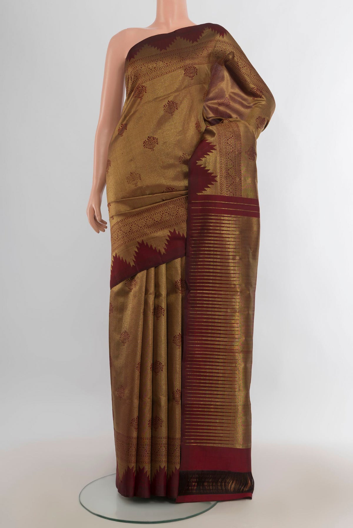 Pure Silk Coffee Brown Kanjivaram Saree with Zari Butta on the body and Silk Border.  displayed on a mannequin