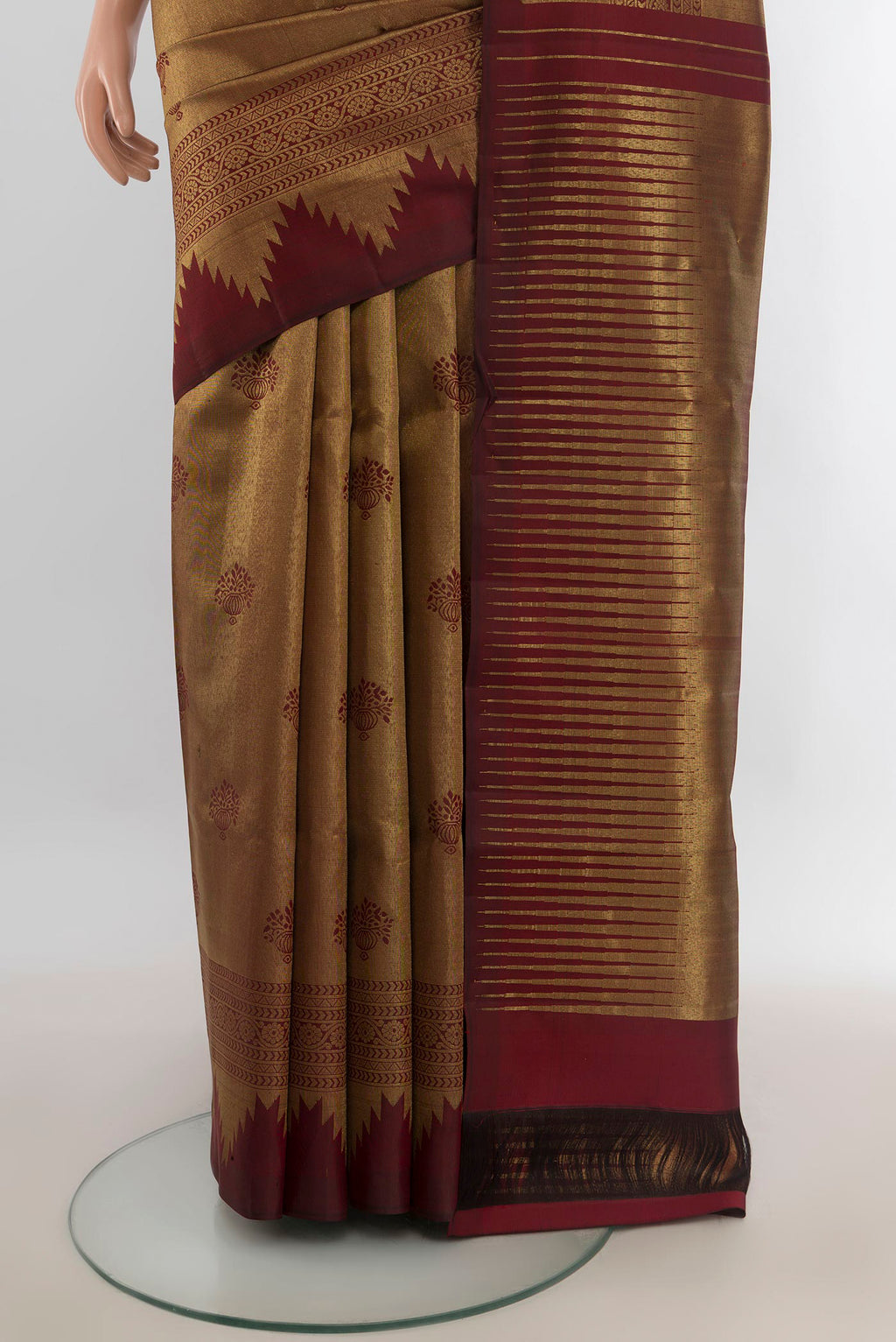 Pleats and pallu of Pure Silk Coffee Brown Kanjivaram Saree with Zari Butta on the body and Silk Border. 