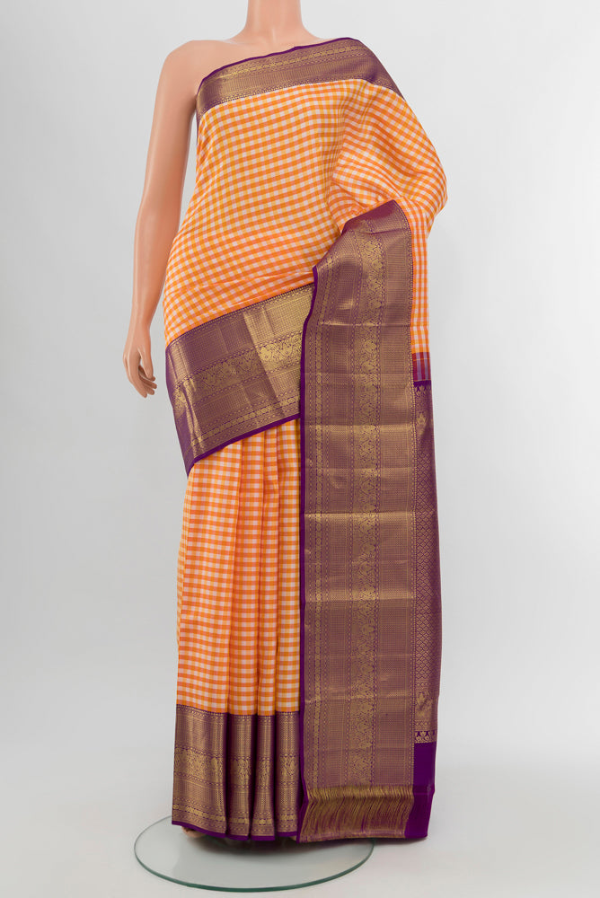 Multi Color Kanjivaram Silk Saree with Zari Butta on the body and Silk Border.  displayed on a mannequin