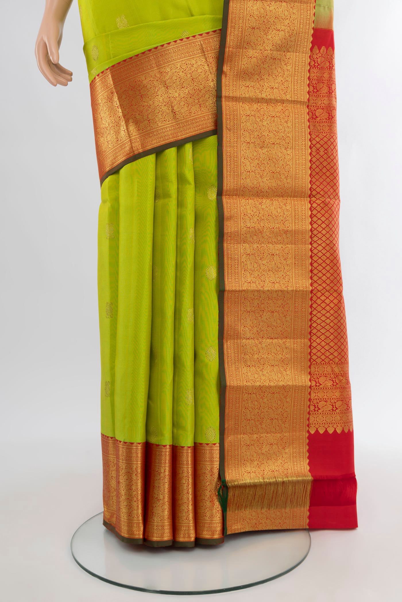 Pleats and pallu of Parrot Green Kanjivaram Silk Saree with Zari Butta on the body and Zari Border. 
