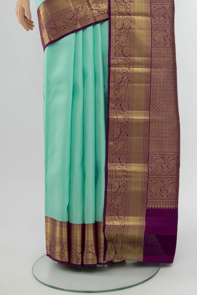 Pleats and pallu of Sky Blue Kanjivaram Silk Saree with Zari Butta on the body and Silk Border. 