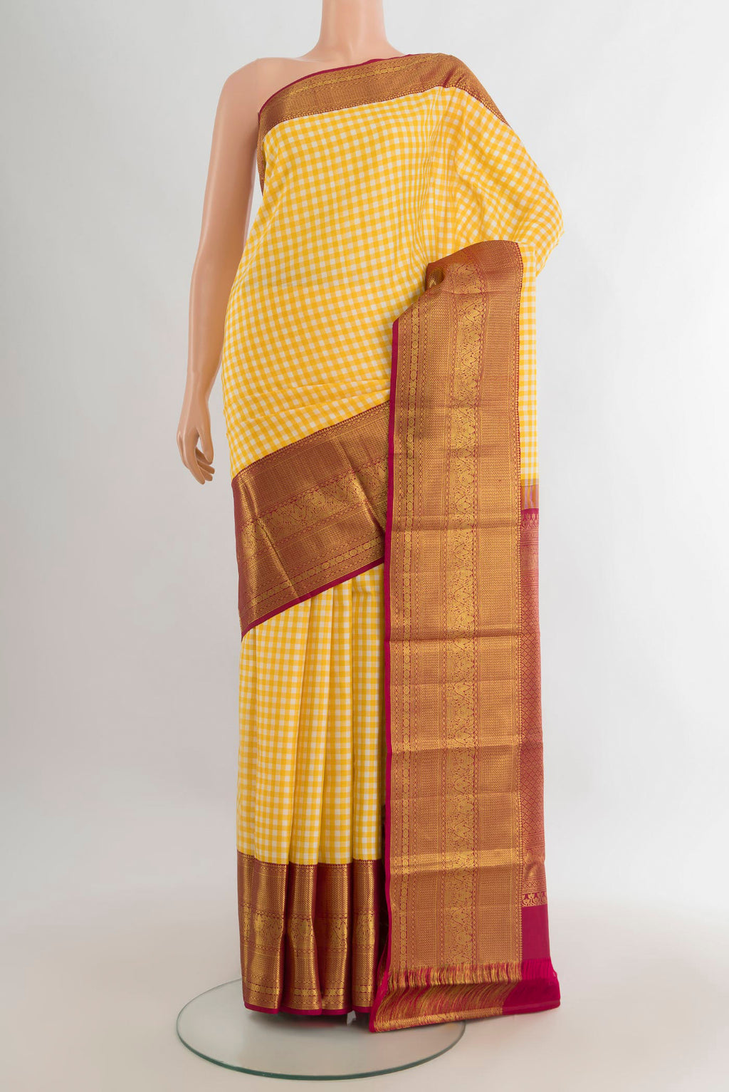 Pure Silk Yellow Kanjivaram Saree with Checked design on the body and Zari Border.  displayed on a mannequin