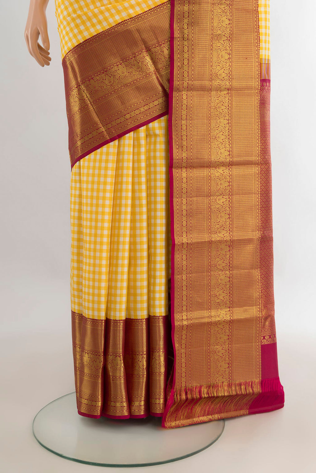Pleats and pallu of Pure Silk Yellow Kanjivaram Saree with Checked design on the body and Zari Border. 