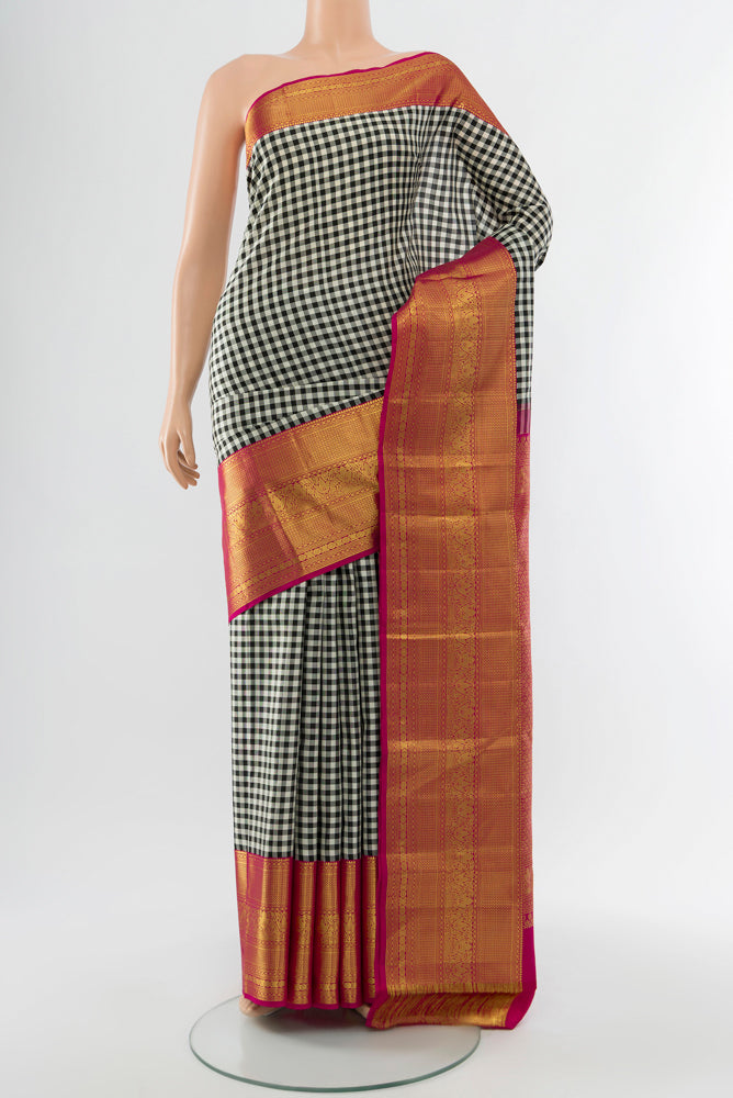 Multi Color Kanjivaram Silk Saree with Checked design on the body and Silk Border.  displayed on a mannequin