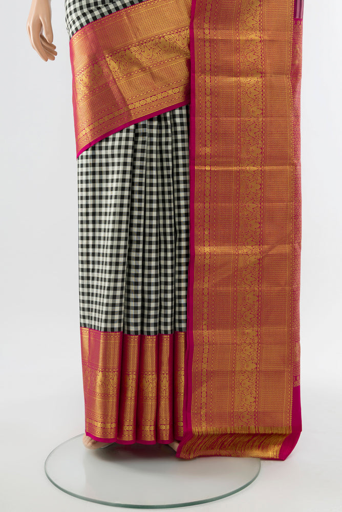 Pleats and pallu of Multi Color Kanjivaram Silk Saree with Checked design on the body and Silk Border. 