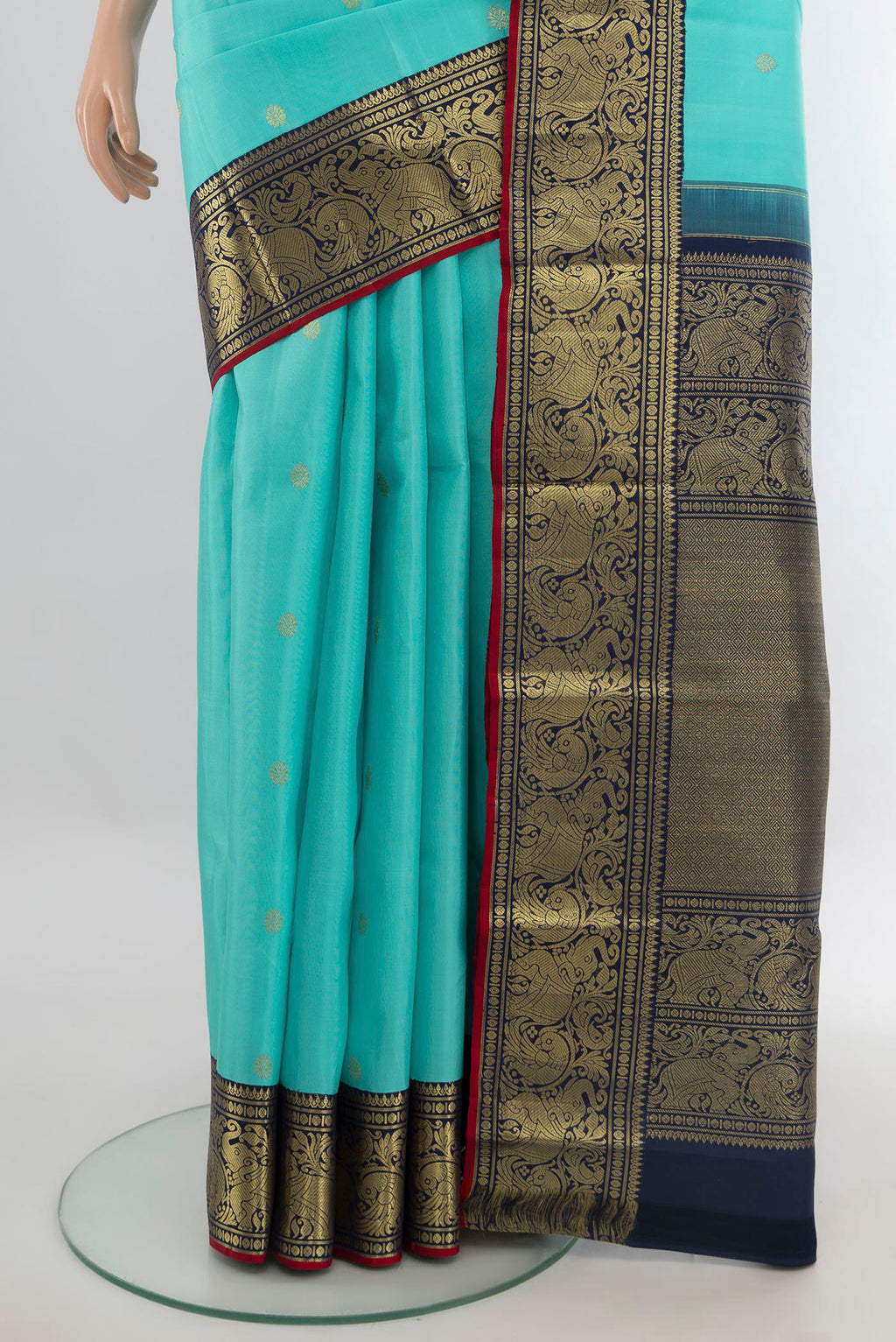 Pleats and pallu of Pure Silk Turquoise Kanjivaram Saree with Zari Butta on the body and Zari Border. 