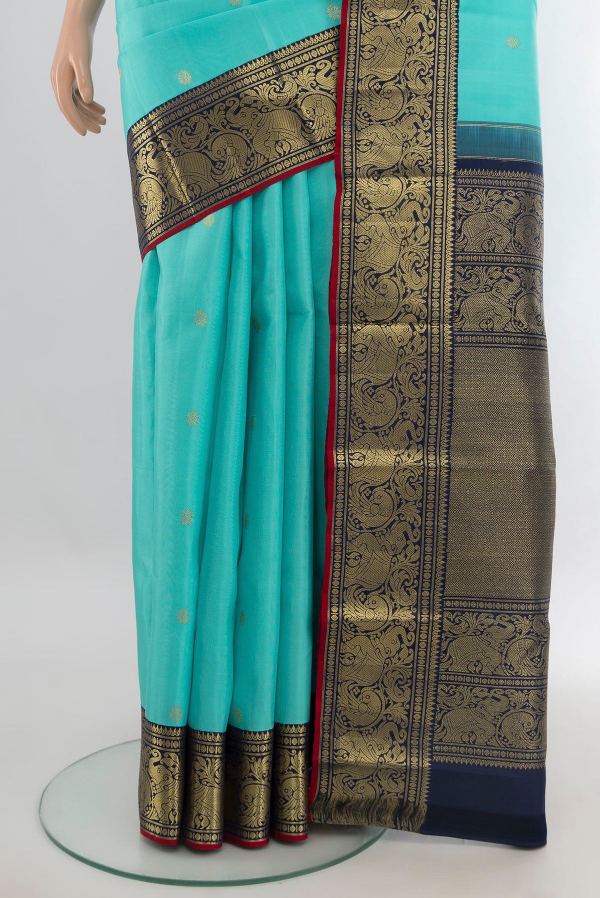 Pleats and pallu of Pure Silk Turquoise Kanjivaram Saree with Zari Butta on the body and Zari Border. 