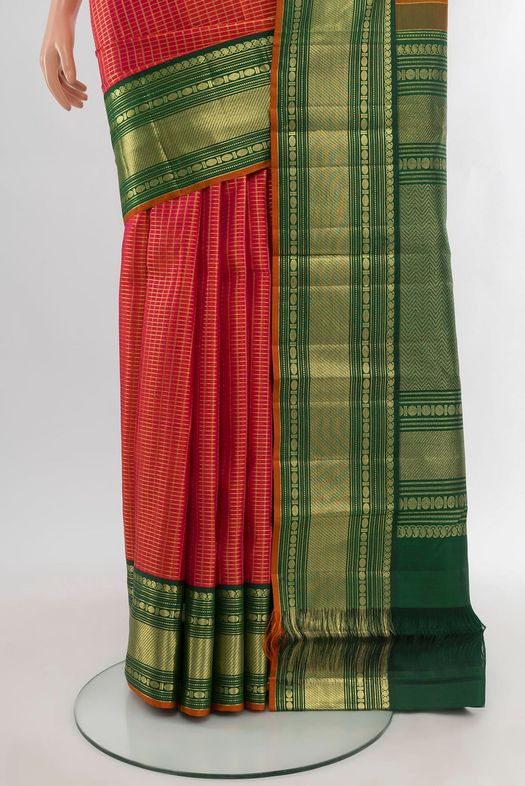 Pleats and pallu of Orange Kanchipuram Silk Saree with Checked design on the body and Zari Border. 