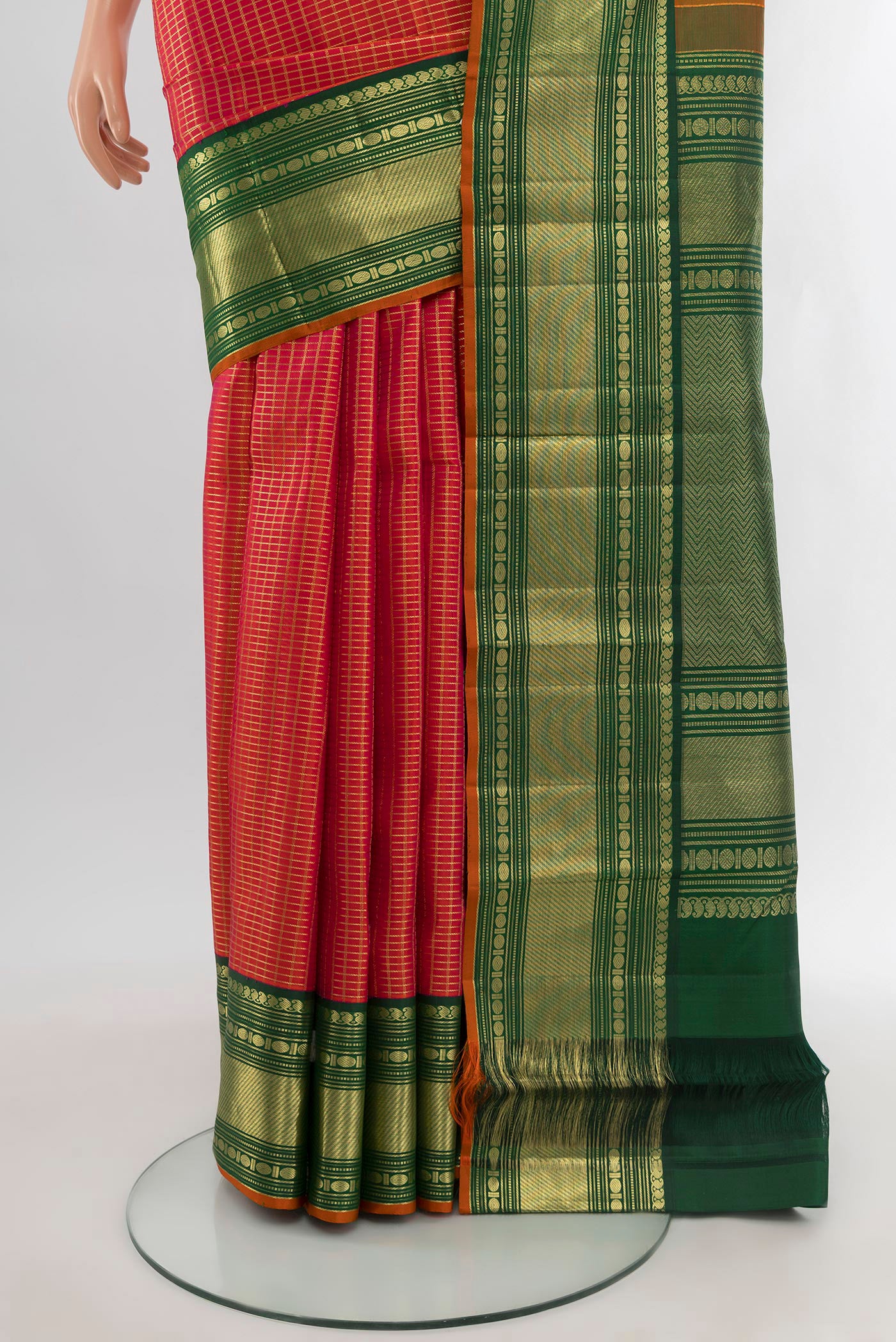 Pleats and pallu of Orange Kanchipuram Silk Saree with Checked design on the body and Zari Border. 