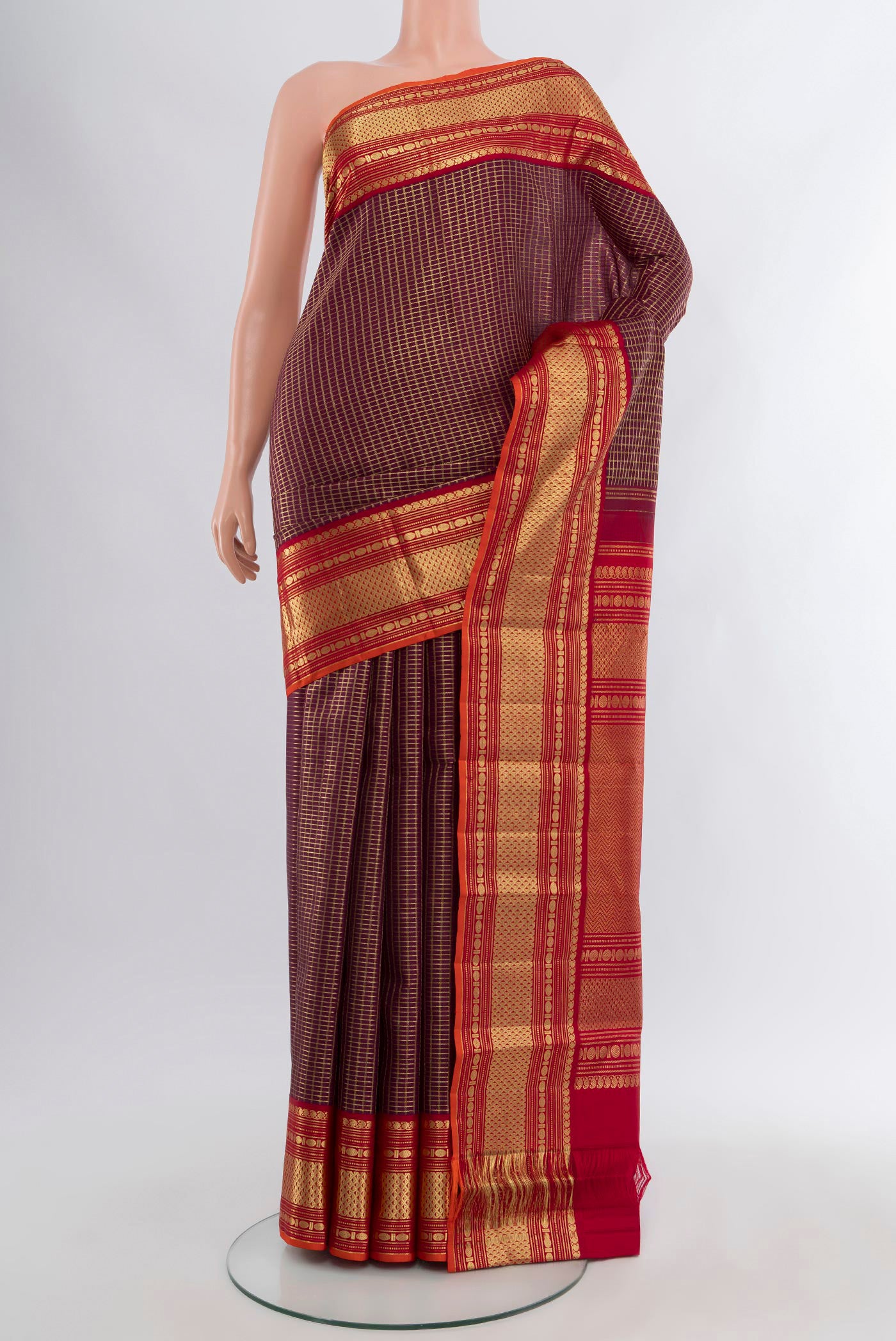 Coffee Brown Kanchipuram Silk Saree with Checked design on the body and Zari Border.  displayed on a mannequin