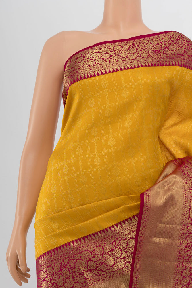 Border image of Yellow Kanchipuram Silk Saree with Zari Butta on the body and Silk Border. 