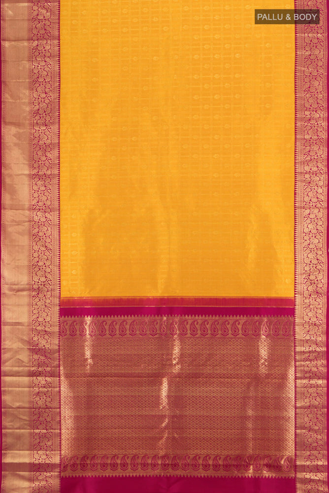Flat view of Yellow Kanchipuram Silk Saree with Zari Butta on the body and Silk Border. 