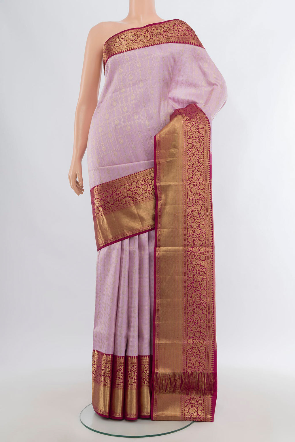 Lavender Kanchipuram Silk Saree with Checked design on the body and Zari Border.  displayed on a mannequin