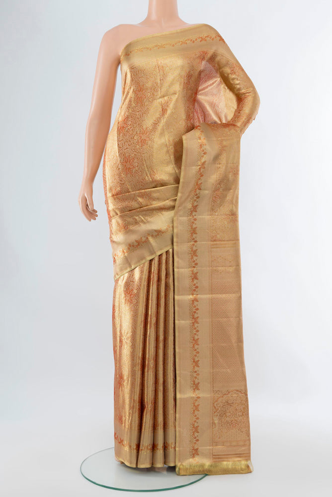 Golden Kanjivaram Silk Saree with Zari Butta on the body and Silk Border.  displayed on a mannequin