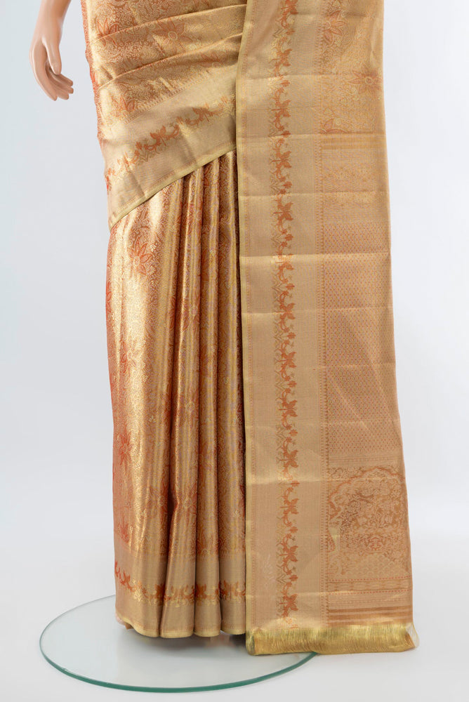 Pleats and pallu of Golden Kanjivaram Silk Saree with Zari Butta on the body and Silk Border. 