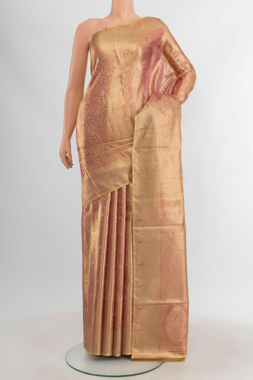 Rose Gold Kanjivaram Tissue Silk Saree with Zari Brocade on the body and Zari Border.  displayed on a mannequin