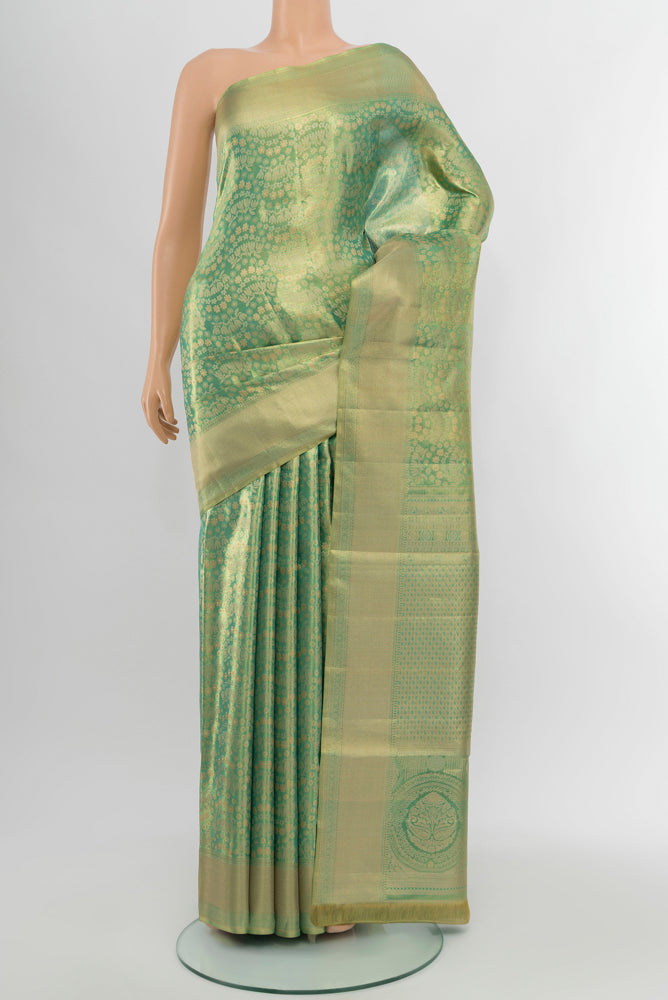 Golden Kanjivaram Silk Saree with Zari Brocade on the body and Silk Border.  displayed on a mannequin