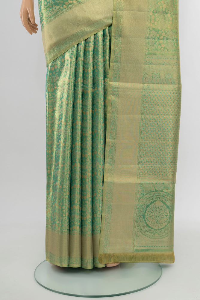 Pleats and pallu of Golden Kanjivaram Silk Saree with Zari Brocade on the body and Silk Border. 