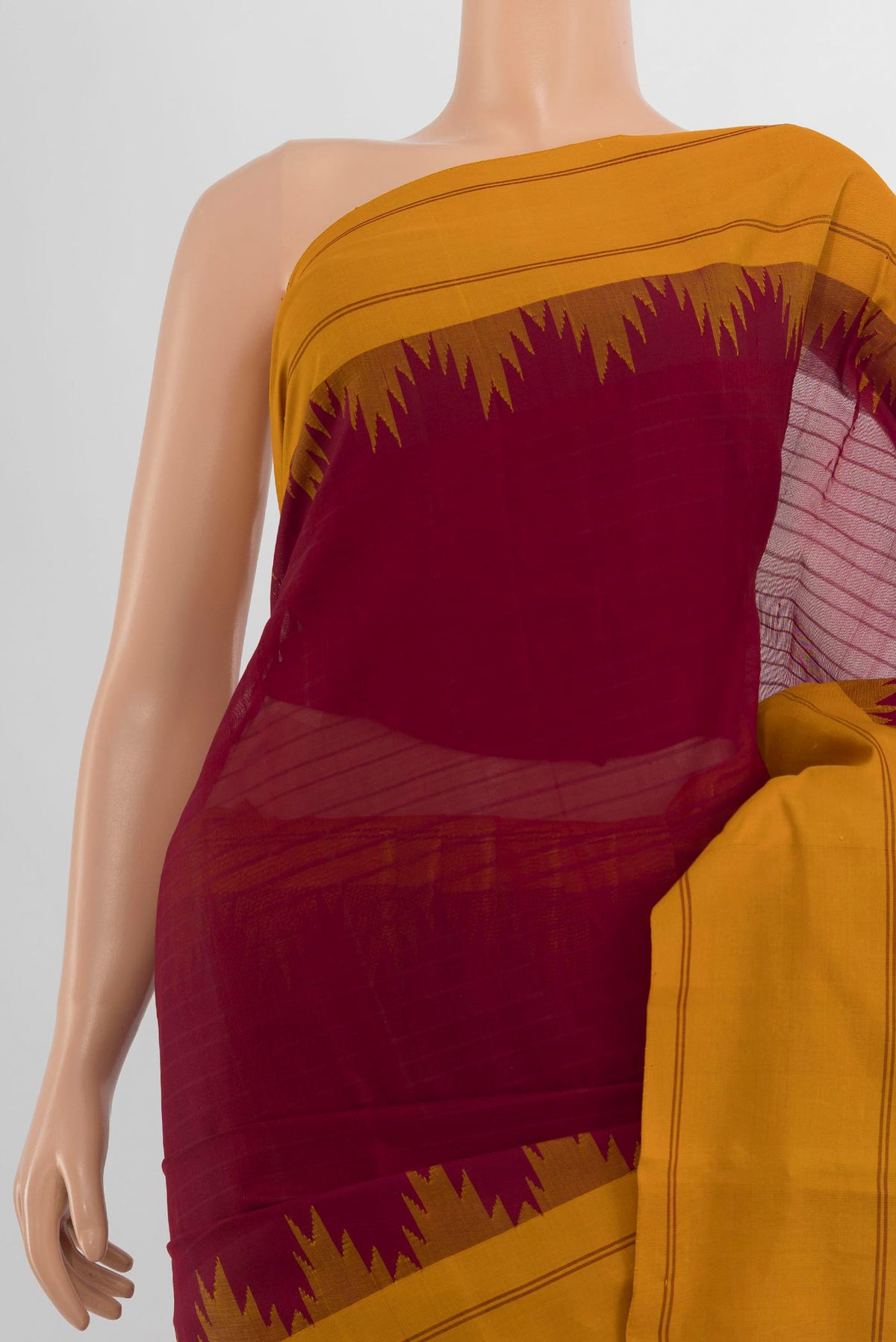 Border image of Maroon Kanchi Cotton Saree with Plain Body and Silk Border. 