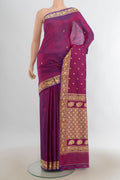 Pure Silk Purple Banarasi Katan Saree with Thread Butta on the body and Silk Border.  displayed on a mannequin