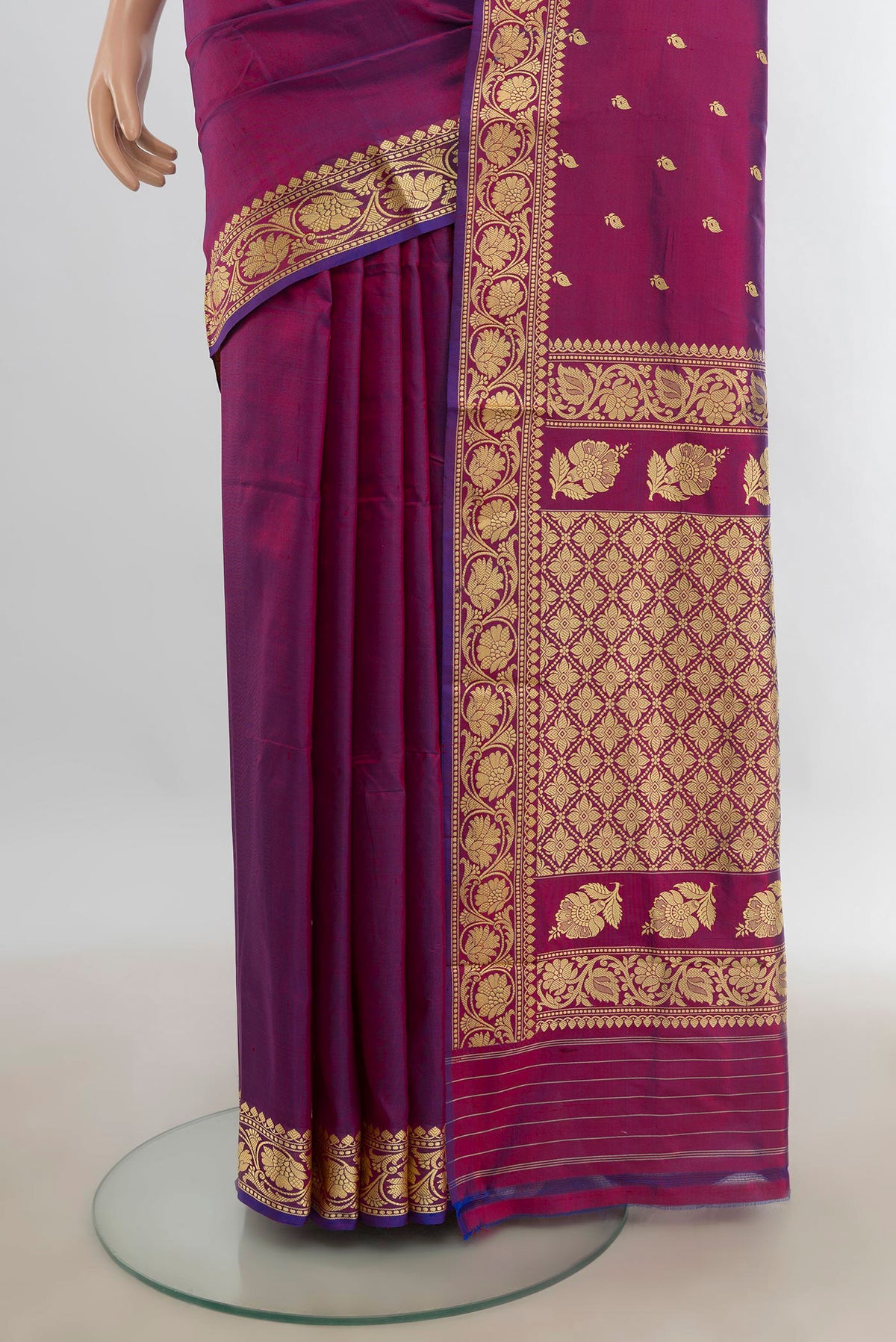 Pleats and pallu of Pure Silk Purple Banarasi Katan Saree with Thread Butta on the body and Silk Border. 