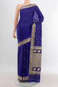 Blue Banarasi Katan Silk Saree with Thread Butta on the body and Thread Border.  displayed on a mannequin
