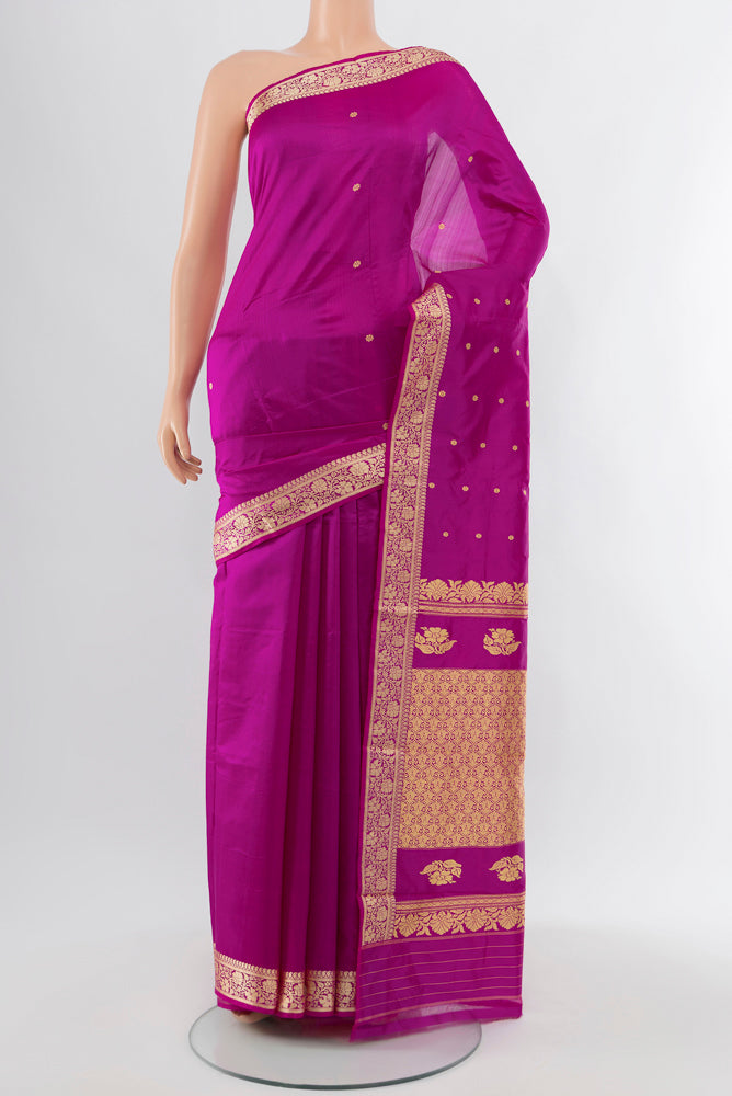 Purple Soft Silk Saree with Zari Butta on the body and Silk Border.  displayed on a mannequin