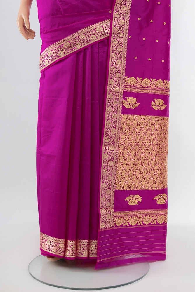 Pleats and pallu of Purple Soft Silk Saree with Zari Butta on the body and Silk Border. 