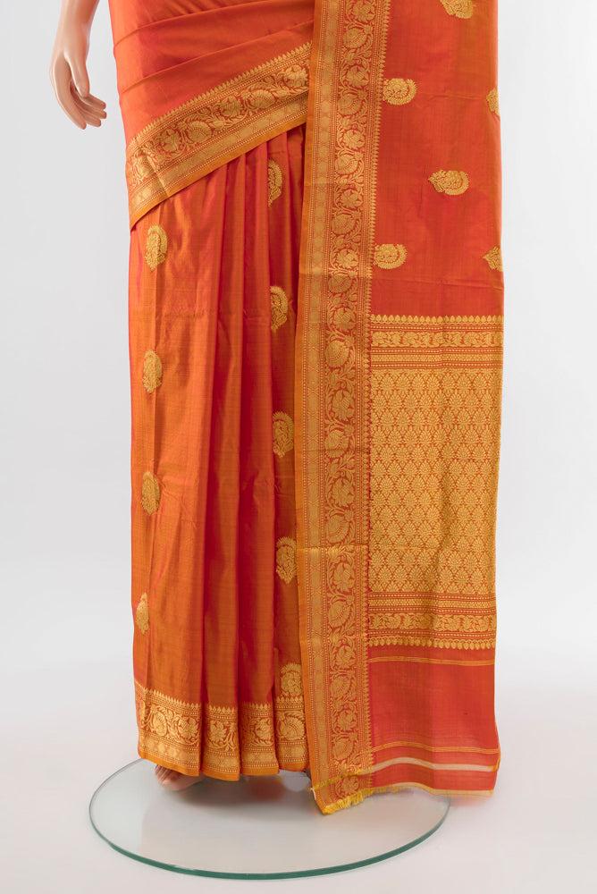 Pleats and pallu of Golden Peach Banarasi Katan Silk Saree with Zari Butta on the body and Silk Border. 