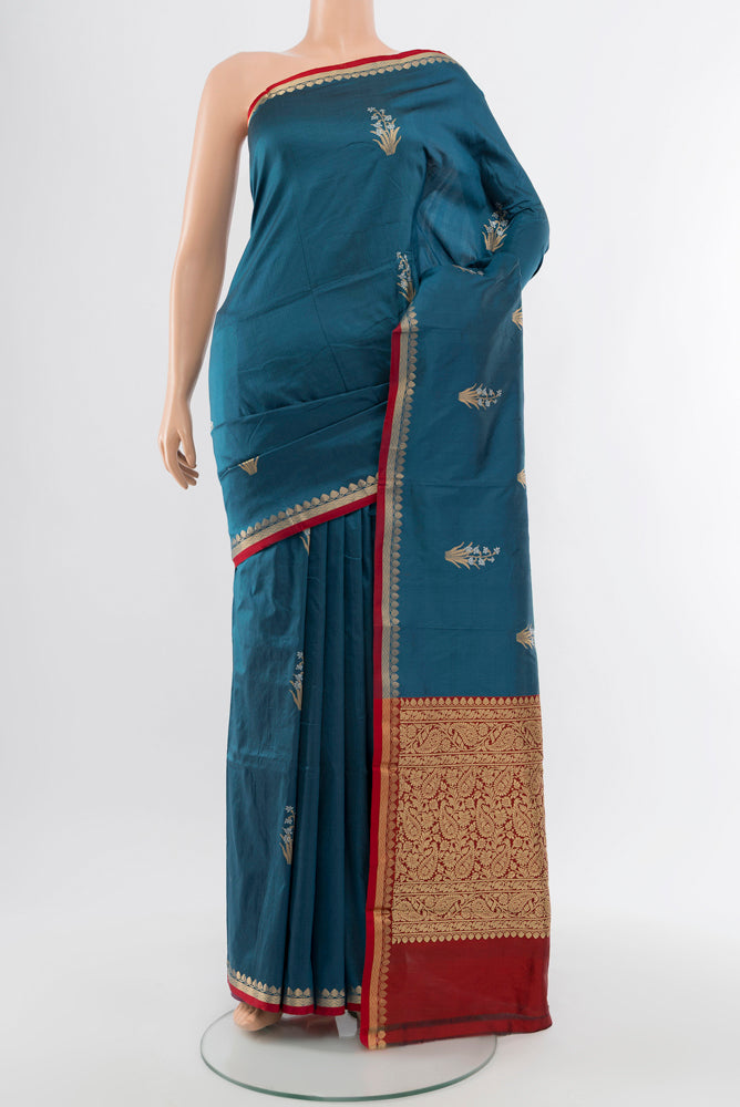 Dark Blue Banarasi Katan Silk Saree with Zari Butta on the body and Silk Border.  displayed on a mannequin