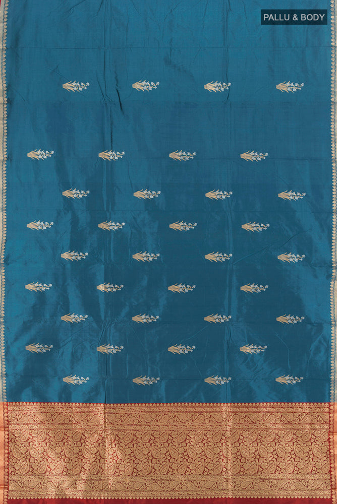 Flat view of Dark Blue Banarasi Katan Silk Saree with Zari Butta on the body and Silk Border. 