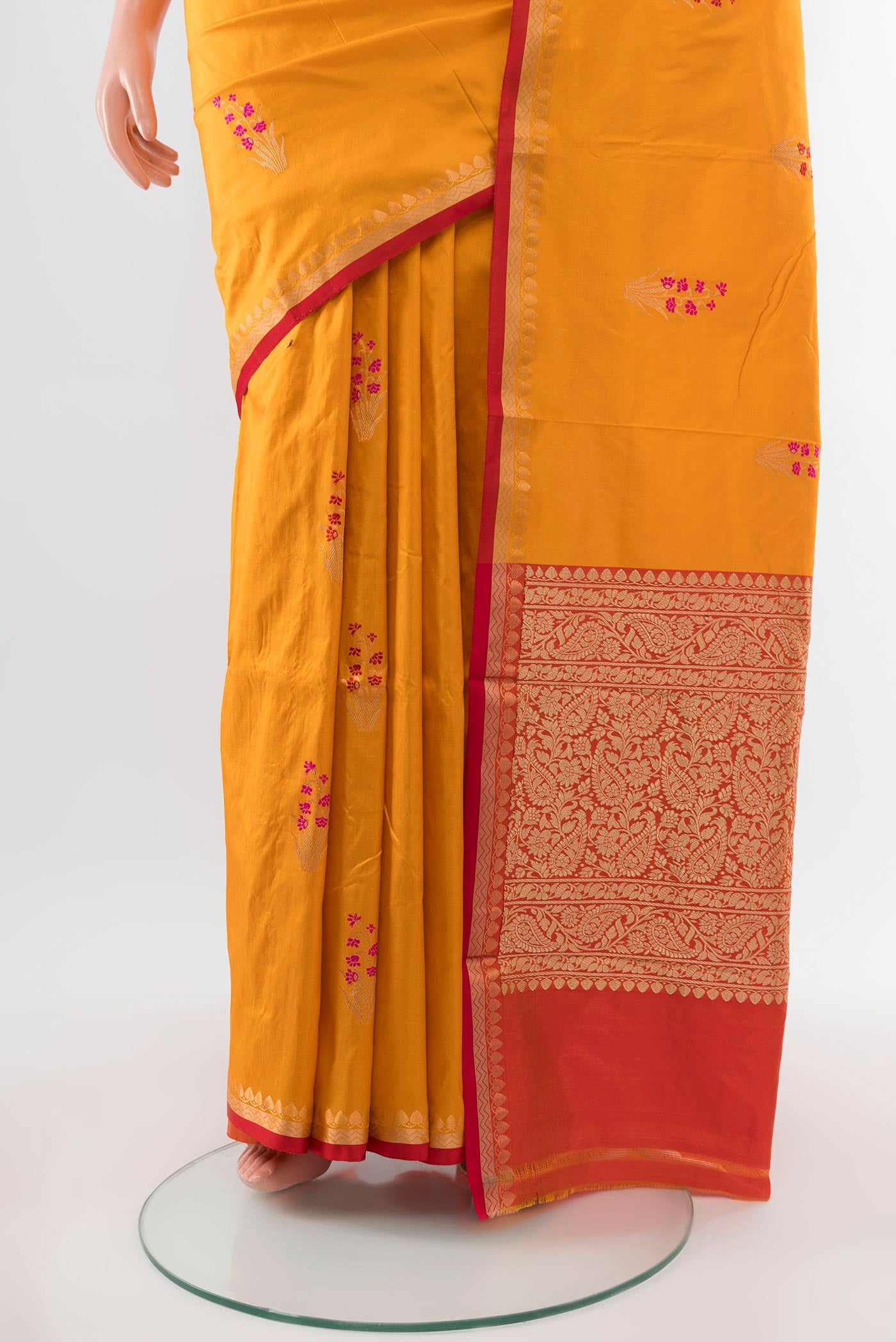 Pleats and pallu of Yellow Banarasi Katan Silk Saree with Zari Butta on the body and Silk Border. 