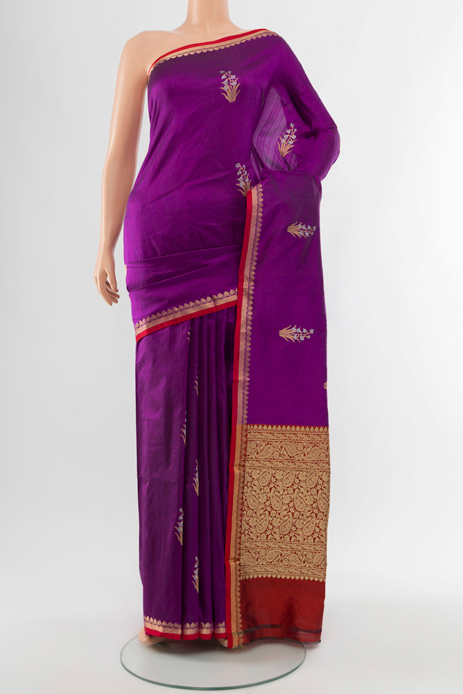 Purple Banarasi Katan Silk Saree with Zari Butta on the body and Silk Border.  displayed on a mannequin