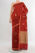 Rust Banarasi Katan Silk Saree with Zari Butta on the body and Zari And Thread Border.  displayed on a mannequin