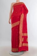 Pure Silk Red Banarasi Katan Saree with Zari Butta on the body and Zari Border.  displayed on a mannequin