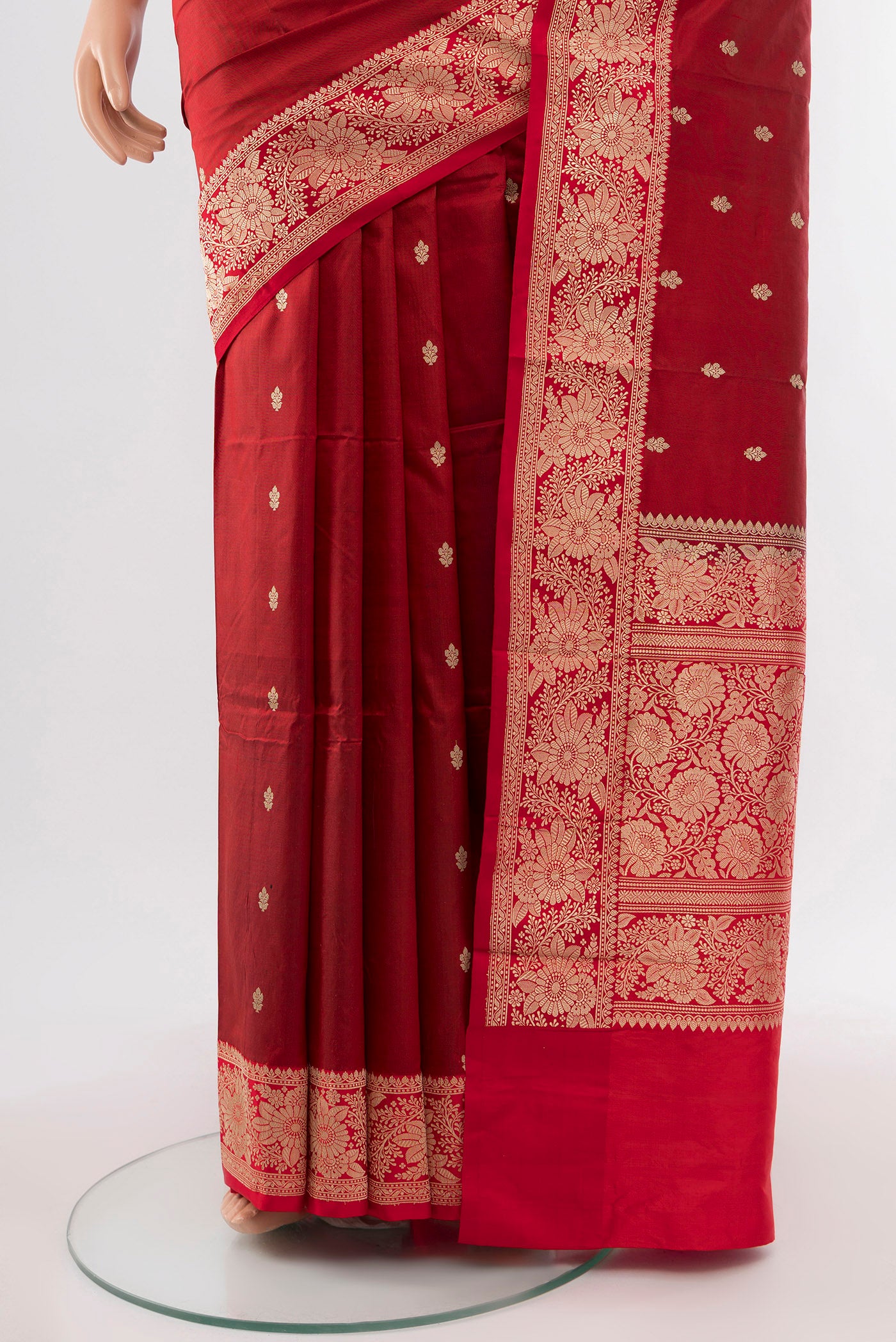 Pleats and pallu of Maroon Banarasi Katan Silk Saree with Zari Butta on the body and Silk Border. 