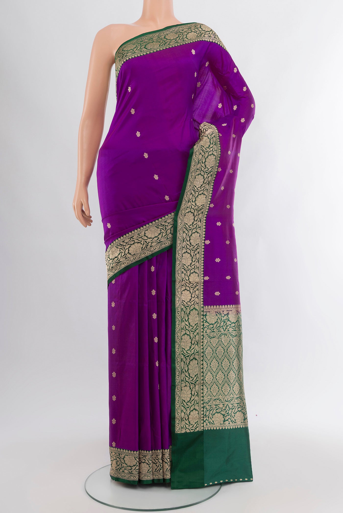 Violet Banarasi Katan Silk Saree with Zari Butta on the body and Zari Border.  displayed on a mannequin