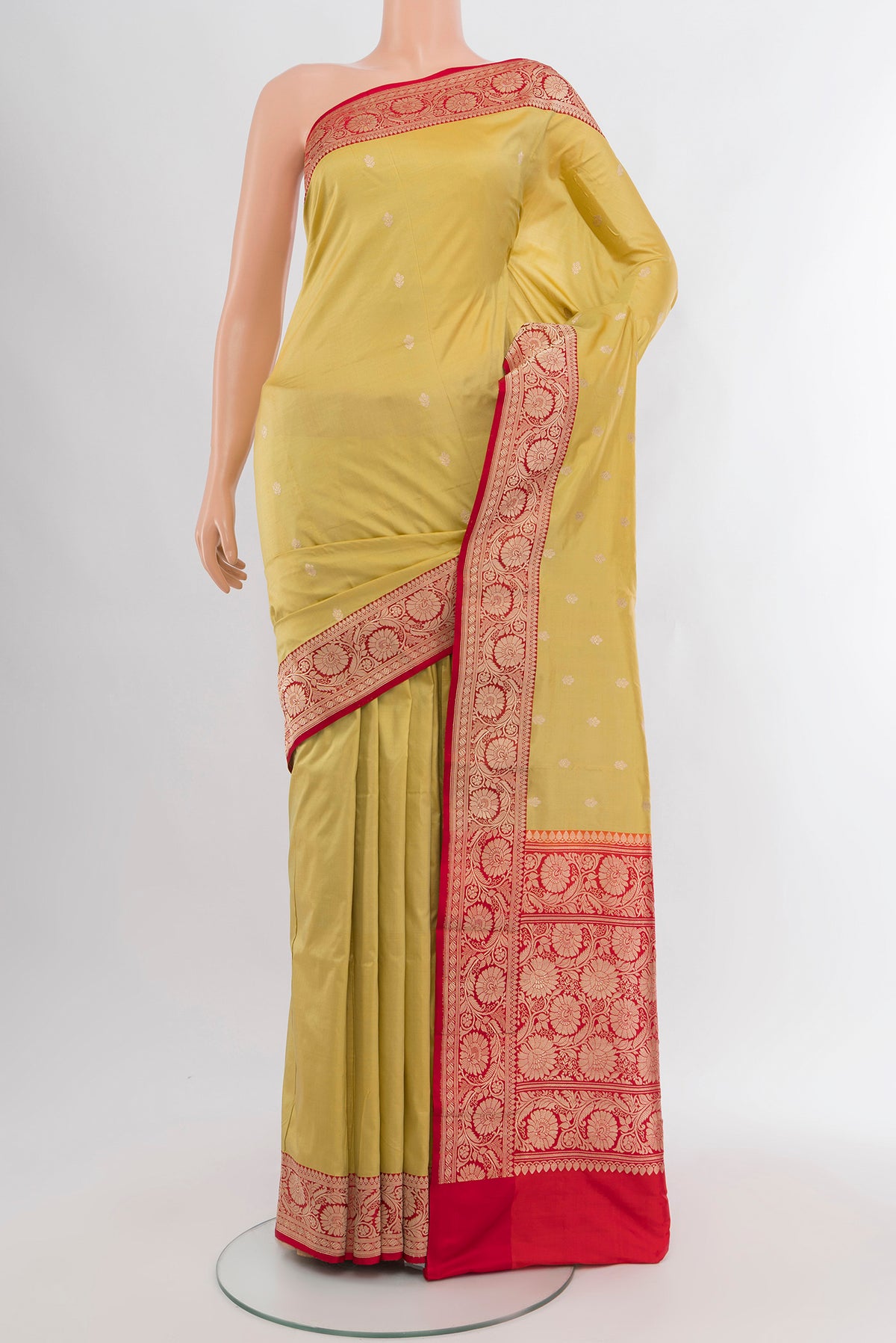 Lemon Yellow Banarasi Katan Silk Saree with Zari Butta on the body and Zari Border.  displayed on a mannequin