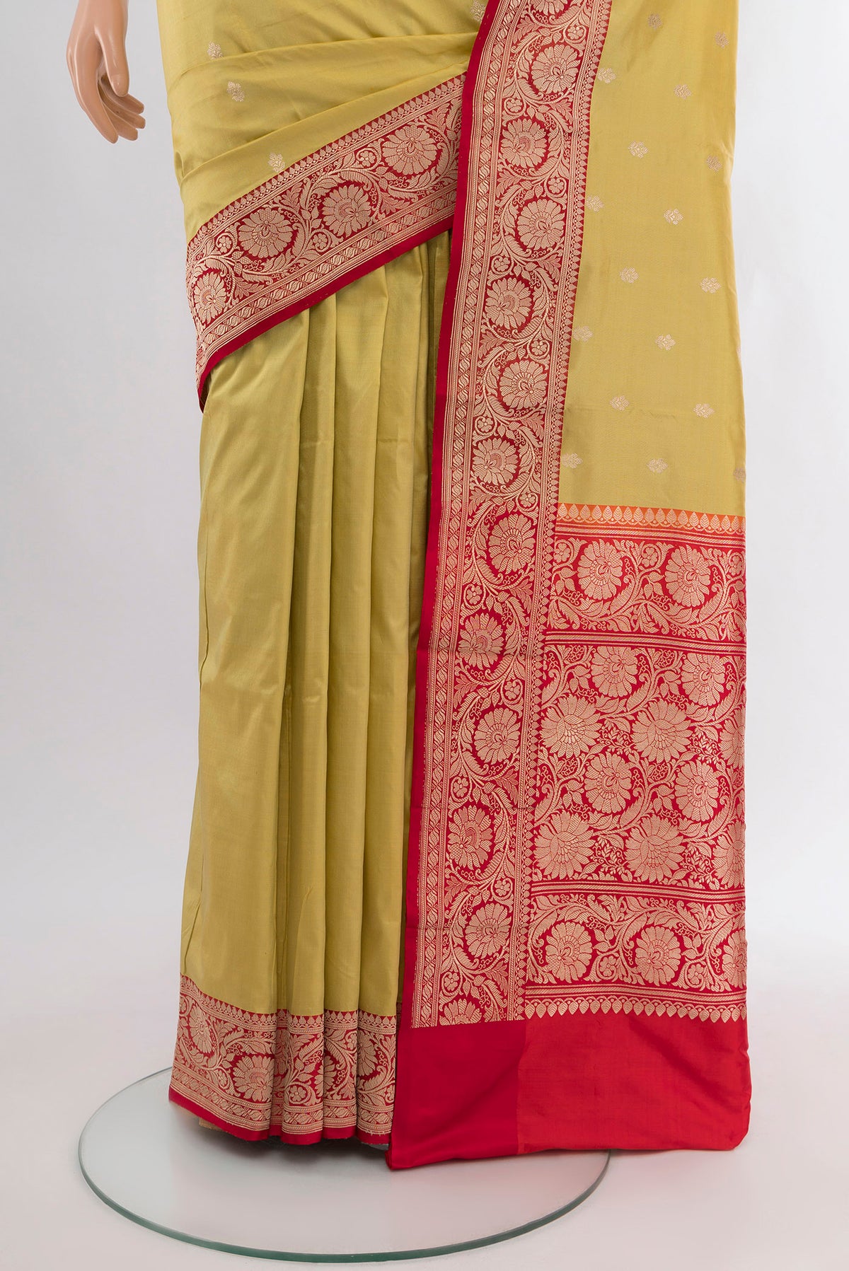 Pleats and pallu of Lemon Yellow Banarasi Katan Silk Saree with Zari Butta on the body and Zari Border. 
