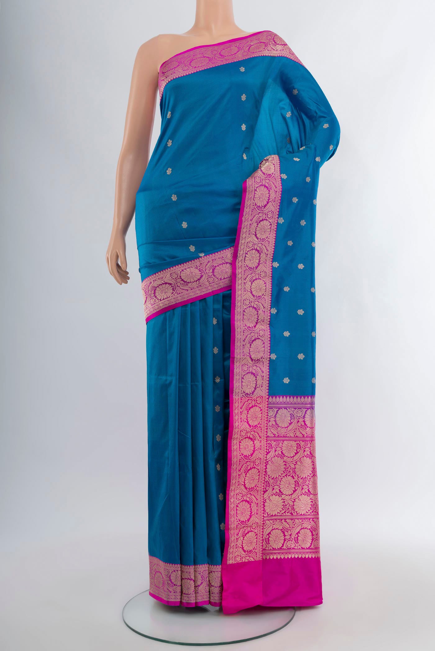 Royal Blue Banarasi Katan Silk Saree with Zari Butta on the body and Zari Border.  displayed on a mannequin