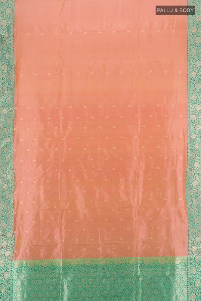 Flat view of Rose Gold Soft Silk Saree with Zari Butta on the body and Silk Border. 