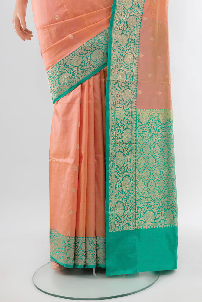Pleats and pallu of Rose Gold Soft Silk Saree with Zari Butta on the body and Silk Border. 
