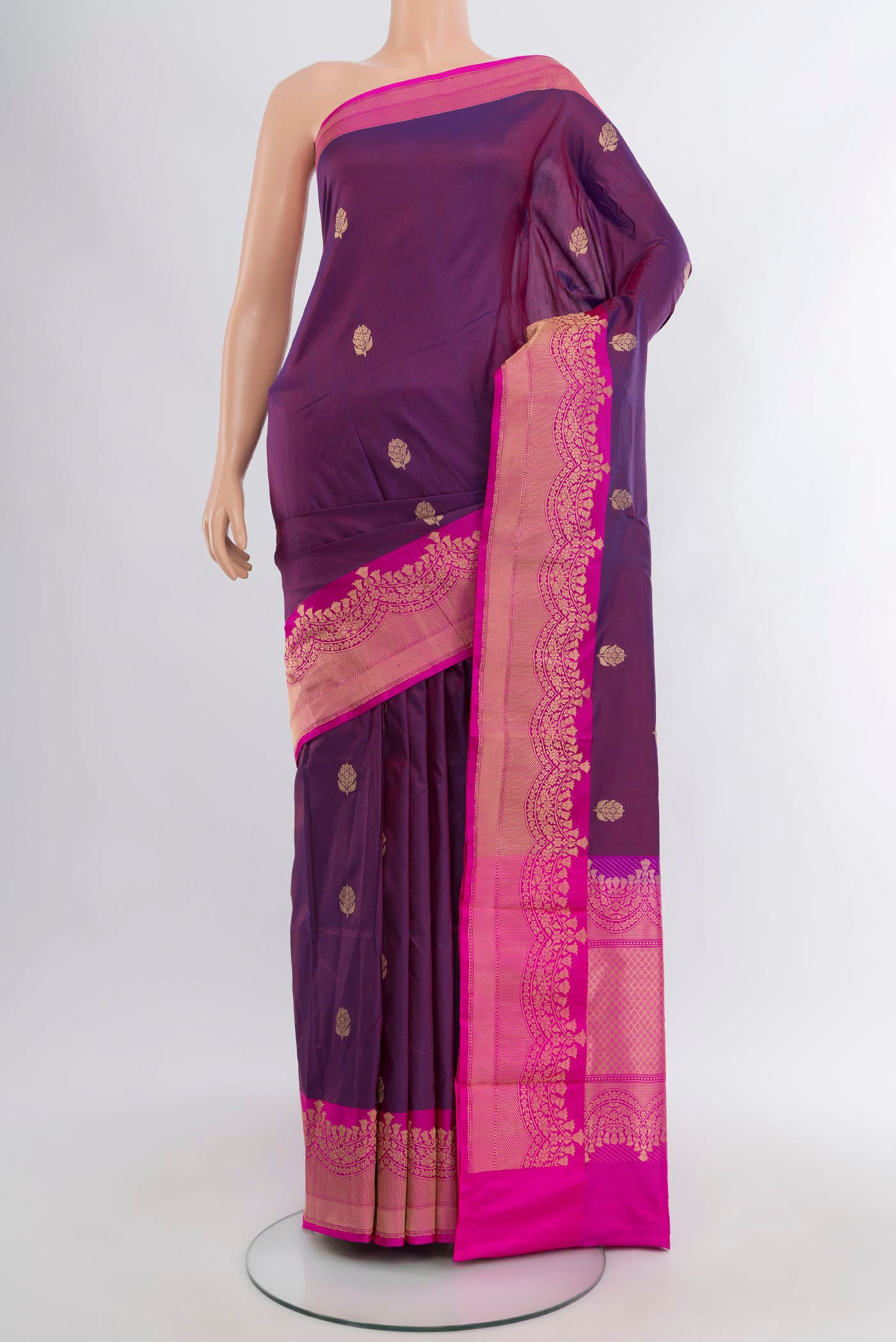 Purple Banarasi Katan Silk Saree with Zari Butta on the body and Zari Border.  displayed on a mannequin