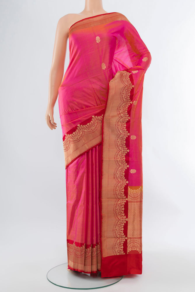 Rose pink Banarasi Katan Silk Saree with Zari Butta on the body and Silk Border.  displayed on a mannequin
