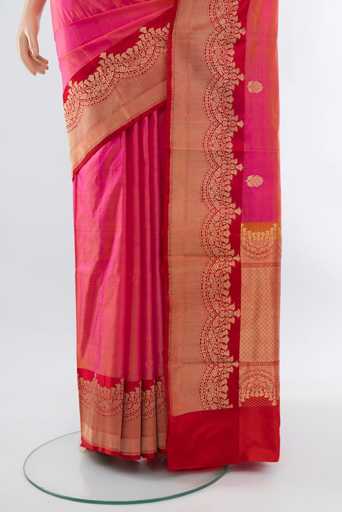 Pleats and pallu of Rose pink Banarasi Katan Silk Saree with Zari Butta on the body and Silk Border. 