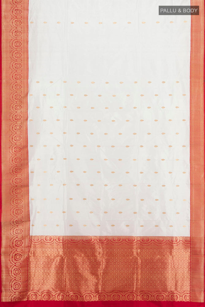 Flat view of Cream Banarasi Katan Silk Saree with Zari Butta on the body and Silk Border. 